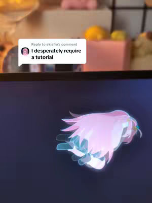 The cover image is divided into two main sections. The top features a blurred background with light colors, including what appear to be food items such as a lemon, and pink and white rectangular packages. The bottom half reveals a screen displaying a luminous, anime-style character with flowing pink hair and a teal glow. A comment box from the user is also overlaid providing a text hook.