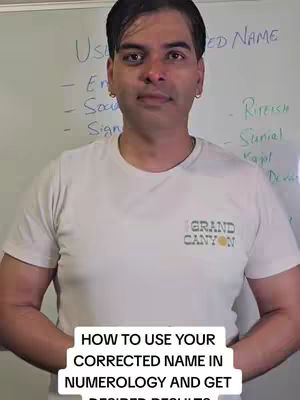 A man in a white t-shirt stands in front of a whiteboard, with text at the bottom of the image. The image uses natural lighting and a straightforward composition, with the man centered and the whiteboard in the background.