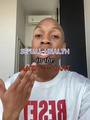 A man with a shaved head is centered in the frame, with text overlays. The background shows a door and a wall.