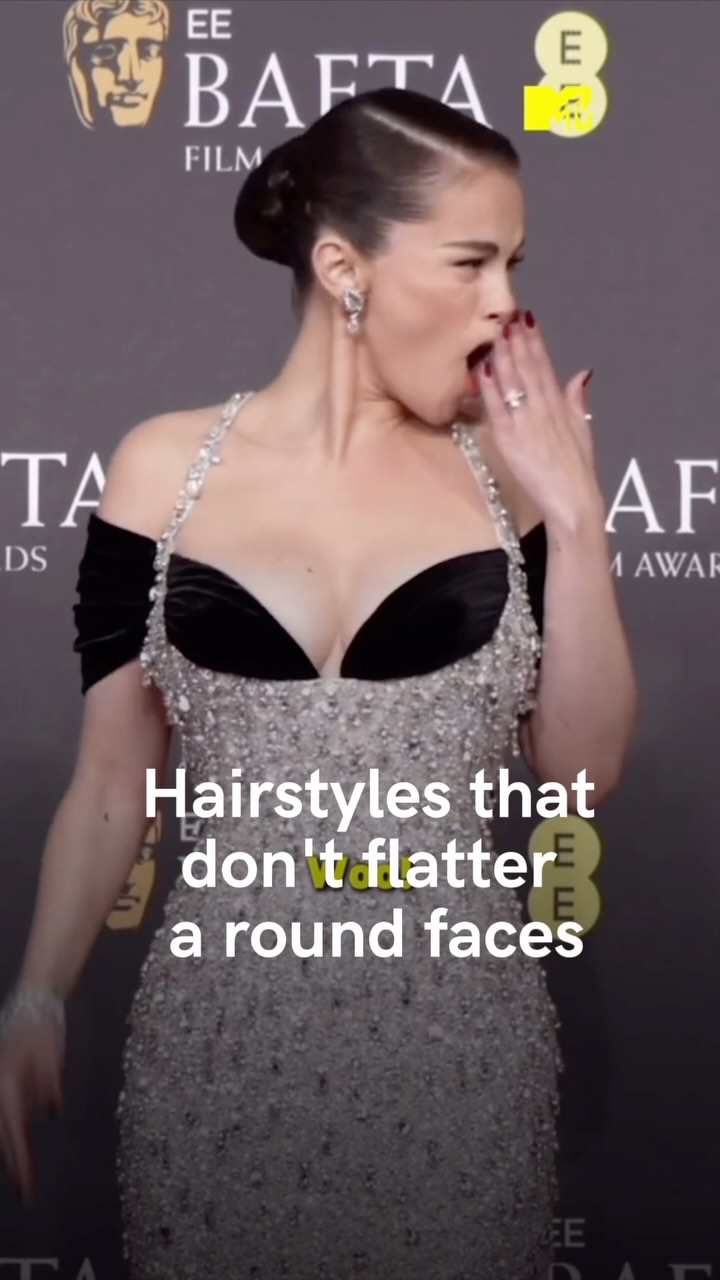 A woman in an elegant dress, mid-yawn, at what appears to be a film awards show; overlayed text indicates the video discusses hairstyles.