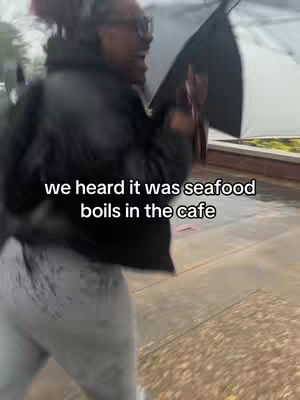 A woman with glasses and an umbrella walks in the rain. Text overlayed across the image.