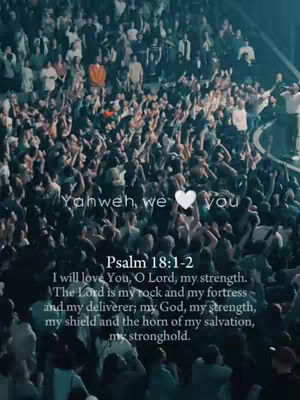 A large crowd with their arms raised in worship, the image is slightly blurred. Text overlays the foreground with a quote from Psalms.