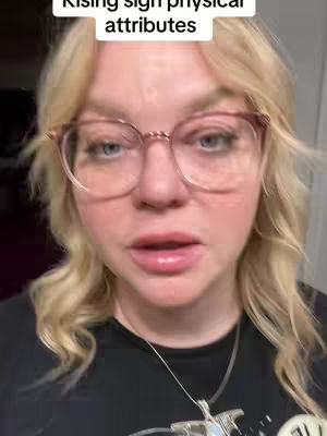 A close-up shot of a woman with fair skin, blonde hair, and glasses. The woman is looking at the camera and talking. There is text overlayed at the top of the image.