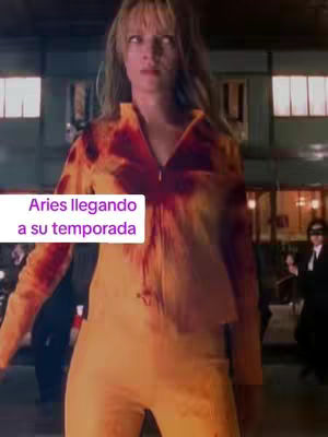 The cover image shows a woman in an orange jumpsuit, possibly from a movie, with what appears to be a blood-like stain on her top. Text overlayed on a white background says Aries llegando a su temporada.