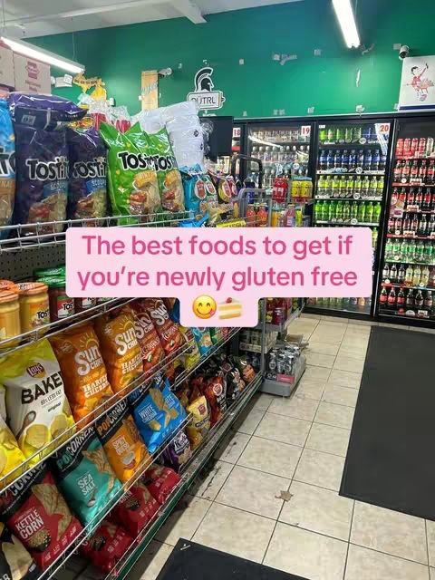A grocery store aisle is filled with various snack foods, including chips and other packaged items. The image is shot at eye level, with a well-organized display of products. The color scheme is diverse, highlighting the different brands and varieties of food items. The overall layout is neat, giving the impression of a well-stocked and inviting environment.