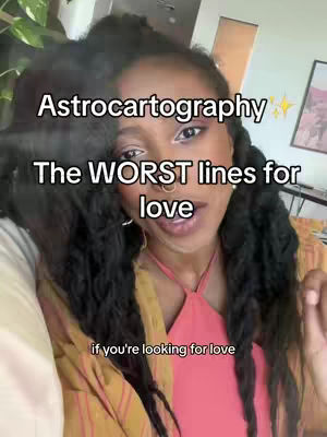 A woman with long, dark hair and multiple face piercings is centered in the frame, looking towards the camera with a slight smile. Text overlays describe 'Astrocartography' as the focus, mentioning 'The WORST lines for love' and 'if you're looking for love'. The background suggests an interior setting, with hints of foliage and possibly a framed picture.