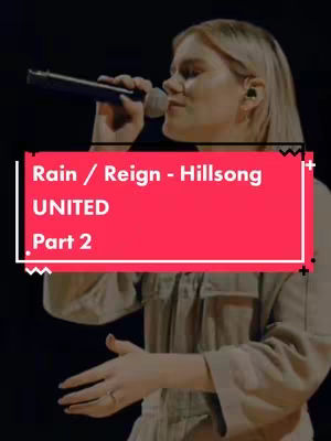 A medium shot of a woman with blonde hair singing into a microphone on a stage. The woman is the central focus, with a red rectangular overlay at the bottom of the frame containing white text.