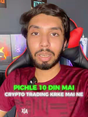 A close-up shot of a man looking directly at the camera while speaking. He has short, dark hair and a beard. The text overlay in the image states, 'Pichle 10 din mai crypto trading krke maine'. The background seems to be a room with computer monitors.