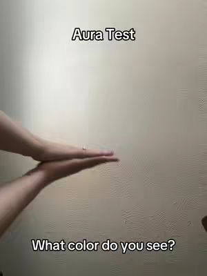 Two hands are held up, palms facing each other with a small gap in between against a beige background, and two lines of text in the image.