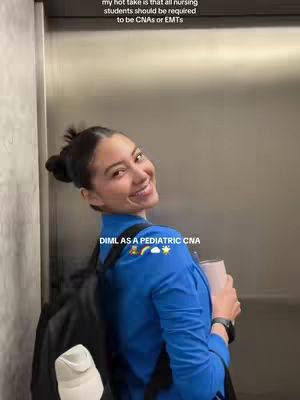 A young woman with her hair in a bun is smiling and looking back at the camera. She is wearing a blue scrub top and a backpack. Text overlays appear at the top and bottom of the image.