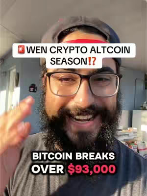 A man with a full beard and glasses smiles at the camera. He's wearing a dark cap and the background is out of focus with a hint of a room. Text overlays in a white bar and below also convey information.