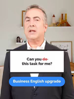 A man in a suit stands in front of a blurred background, with a white rectangle overlay at chest level displaying text. Below this, a blue button-shaped element reads "Business English upgrade."