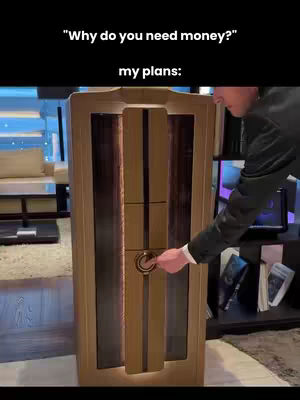 A person in a suit is shown to the right, reaching towards a tall, light-colored cabinet or vault. The cabinet has a vertical design with wooden panels and a circular handle. Text is overlaid at the top, asking "Why do you need money?" with "my plans:" below.