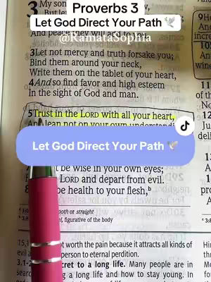 The cover image features an open Bible with highlighted text from Proverbs 3:5-6. Overlaid are several textual elements: a title reading 'Let God Direct Your Path,' the creator's handle, and a secondary text overlay. Highlighting and a pink pen point to the text. The color palette is predominantly muted, with natural light illuminating the pages.