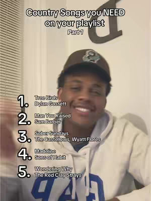 A selfie-style image featuring a young man in a hoodie and a baseball cap. Text overlays list country music songs.
