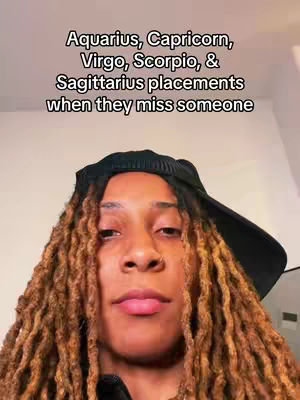 A selfie-style video cover shows a person with long, light brown dreadlocks, wearing a black cap. The person's face is centered, with a neutral expression. Text overlays at the top of the image read. The background appears to be a plain, light-colored wall.