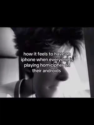 A black and white image showing a close-up of a person’s face, likely a young male, in profile. Text overlay displays the phrase, 'how it feels to have an iphone when everyone is playing homicipher on their androids'. Shadows and grain add texture.