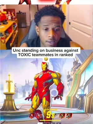 The cover image is a vertical split screen. The top half shows a live video feed of a Black male with short, dark curly hair, looking directly at the camera with a focused expression. The bottom half features an Iron Man-like character in a video game setting. The character is rendered in a stylized, cartoonish style with a red and gold color scheme, posed heroically with one hand in front. Text overlays are present to convey information or add context.