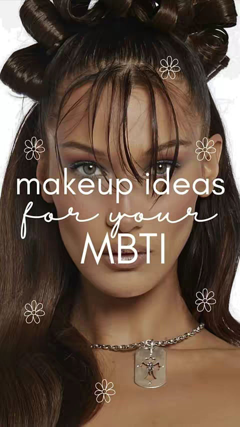 A close-up of a woman's face, featuring dramatic eye makeup and stylized hair with floral embellishments. The text overlayed indicates the video's focus on makeup ideas based on the MBTI personality types.
