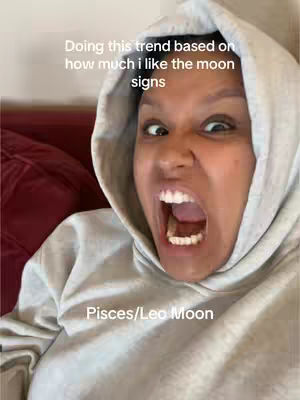 A close shot features a person with a distressed expression, mouth wide open, framed by a grey hoodie. The background is partially obscured, with a dark red area visible to the left. Text overlays appear across the top and bottom, adding context.