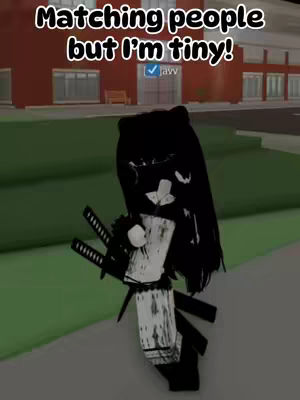 A Roblox avatar, with long black hair and accessories, stands in a virtual outdoor setting with a blurred background. Text overlayed on the image reads 'Matching people but I'm tiny!', and the avatar has a checkmark next to its name.