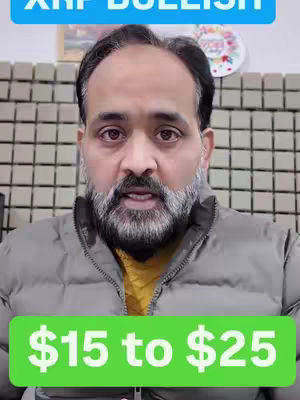 A man with a beard is centered in the image, looking directly at the camera with a slight smile. The background features off-white, textured blocks. The man wears a gray jacket over a yellow shirt. Text in large white font on a green background at the bottom reads "$15 to $25". At the top is a blue background with the text "XRP BULLISH".