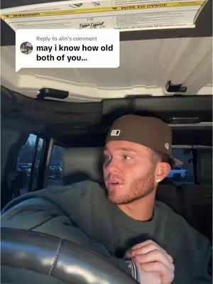 The cover image shows a man inside a vehicle looking towards the camera with a surprised expression. The text overlay from a comment saying "may i know how old both of you..."