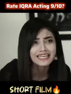 The cover image features a woman with dark hair, looking distressed and seemingly reacting to something off-screen. Text overlays read 'Rate IQRA Acting 9/10?' at the top and 'SHORT FILM' at the bottom, with a flame emoji. The background is plain, focusing attention on the woman's emotional expression.