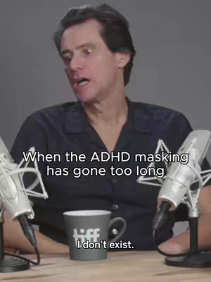A man (Jim Carrey) sits in front of microphones, looking directly at the camera with an open mouth as if speaking. Text overlays on the image.
