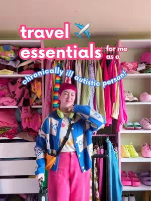 A person with short, pink hair and a red hat stands in front of a closet filled with clothing and shoes. They are wearing a blue and white patterned jacket, pink pants, and a yellow bag. Text overlays across the top of the image.