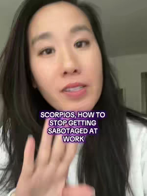 A woman with long black hair is looking at the camera and speaking. Text overlayed on the cover says, “Scorpios, how to stop getting sabotaged at work”. The background appears to be a neutral interior.