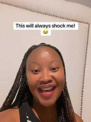 A selfie-style video featuring a young woman with long braids, smiling widely while looking at the camera. A text overlay at the top reads: "This will always shock me!" along with a laughing emoji.