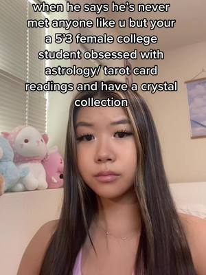 The image features a young woman in a selfie-style shot, with text overlayed at the top. The woman has long, dark hair with blonde highlights, fair skin, and is looking directly at the camera with a neutral expression. She is wearing a light pink top or bra. Behind her, there are white curtains and a stuffed panda. The overall lighting is natural and the background is soft.