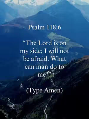 A serene image of a mountainous landscape serves as the backdrop for a religious verse. The sky transitions from blue to a gradient, suggesting either dawn or dusk. Overlaid on this are layers of text, forming a quote from Psalm 118:6 and an instruction to type "Amen".