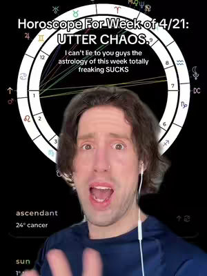 The cover image features a man with surprised expression, likely the creator, in focus. Behind him is a circular astrological chart with a black background, and text overlays in white. The man has his mouth open and wears headphones. He is positioned in front of a circular astrological wheel.