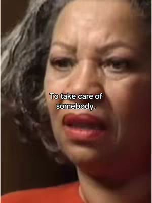 The cover image is a close-up of a woman's face, likely Toni Morrison, looking up and slightly to the left with a concerned or inquisitive expression. The background is blurred, suggesting a close focus on the face. Text overlayed in the image includes the phrase, 'To take care of somebody'. The color palette seems natural, with skin tones and a possible red-orange top, and overall the composition is intimate and direct.