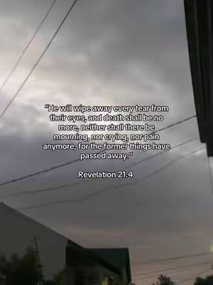 The image shows a cloudy sky with text overlayed. The text provides a Bible verse, likely from Revelation 21:4, with the quote displayed in a white font.