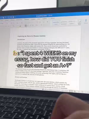 A laptop displaying an essay titled 'Exploring the Marvel of Human Anatomy'. The screen is filled with text. A text overlay is present with a cartoon character image. A hand with manicured nails is visible on the keyboard