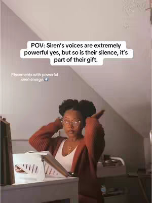 The cover image shows a young woman in a room with neutral-colored walls and a slanted ceiling. The woman, with curly hair styled in two buns, is wearing glasses and a rust-colored long-sleeved top. She's positioned near a white desk containing a tablet and other items. The text overlay is on a white rectangular box in the upper part of the image.
