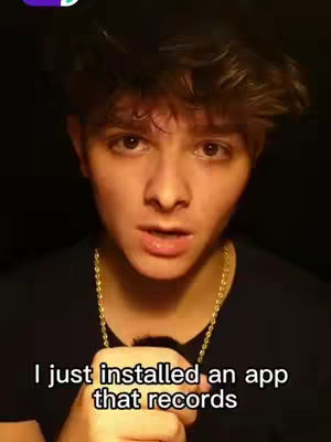 A young man with dark hair and a gold chain is centered in the frame, appearing to speak directly to the camera. Below him, white text overlays, giving further context of what's happening.