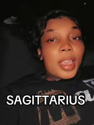 A close-up shot features a young woman with dark hair, looking directly at the camera with a slightly open mouth and tongue visible. Below her is a text overlay with the word 'SAGITTARIUS'. The background appears dark, possibly indoors.