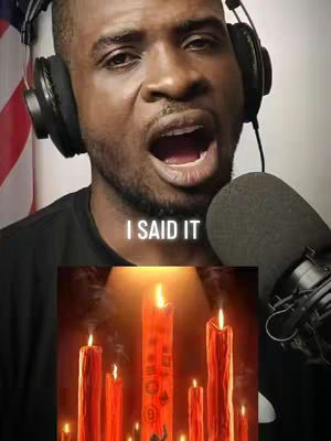A close-up shot of a Black man wearing headphones and a microphone close to his mouth, with the text "I SAID IT" in a white font overlayed on the image. Below the man's face is an image of several burning candles.