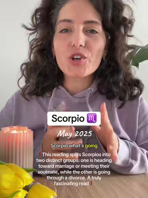 A woman with curly dark hair is centered in the frame. She is speaking, and a text overlay covers part of the image. A candle and yellow tulips are at the bottom of the image