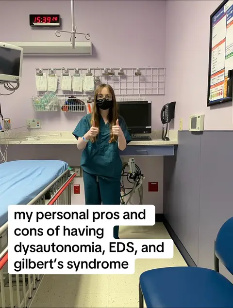 A woman in medical scrubs and a face mask stands in what appears to be a medical room, giving a thumbs up with both hands. Text overlays are present on the image.