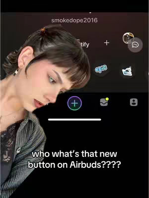 A woman with dark hair and bangs is looking down at the bottom left corner of the screen, where text overlays. The upper part of the screen displays an app interface with icons and user info. The background is dark.