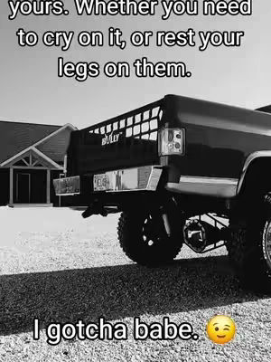 A black and white photo of a truck parked on gravel in front of a house. Text is overlaid on the image.