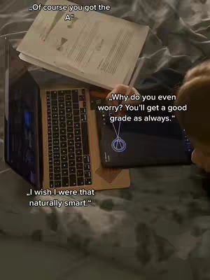 The image shows a person using a laptop and a tablet, with papers stacked on top of the laptop. The scene is set on a bed, with text overlays containing motivational phrases.