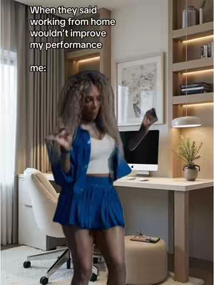 A woman in a blue skirt suit and a white top is dancing in her home office. She is in motion, with a playful pose, and the background shows a desk, computer, and bookshelves. Text overlays the image.