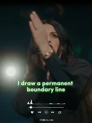 The cover image shows a woman with long dark hair in an indoor setting. She is raising her right hand, palm forward, as if making a gesture. Text overlaid in a green font says, 'I draw a permanent boundary line'. Below, there is a sound wave visualizer and playback controls. The background is blurred and dark.