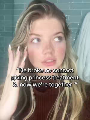 The cover photo features a young woman with long blonde hair and fair skin, looking towards the right with a thoughtful expression. She is indoors, partially obscured by a white cloth draped over a rod. The room appears to have a blue-tiled wall. The text overlay on the image is placed towards the lower-center, written in white font.